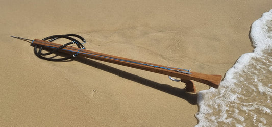 Kingi wooden speargun on beach